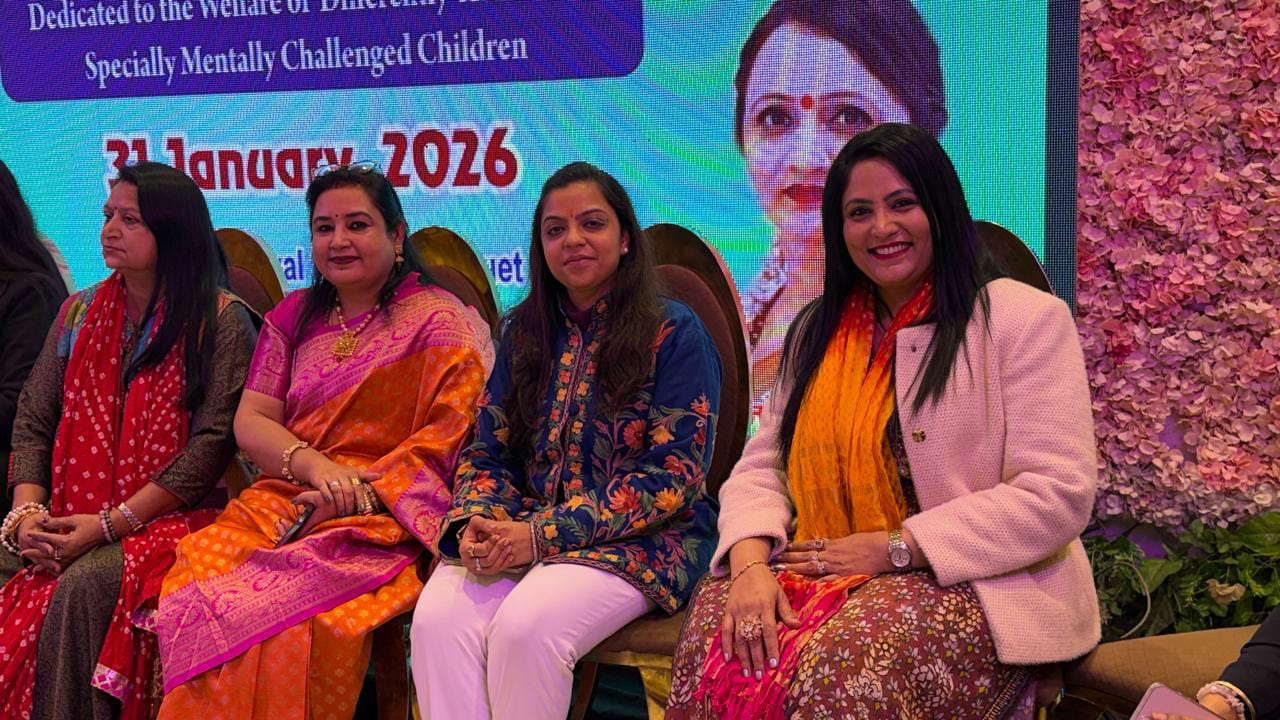 Neeru Aggarwal seated with fellow attendees at an event